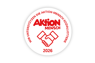 Sigel der Aktion Mensch für 2026 - zwei Hände beim Händedruck 