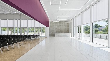 Foto Kulturhalle mit Bestuhlung und Sichtbeton