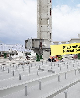 A building site with concrete buildings, steel girders and construction workers wearing safety equipment, under a partly cloudy sky